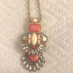 Pretty long gold and coral necklace.